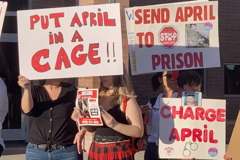 Image: Animal activists gathered outside the Chandler Municipal Courthouse on Oct. 11 to call attention to the alleged abuse suffered by dogs in April McLaughlin's care.