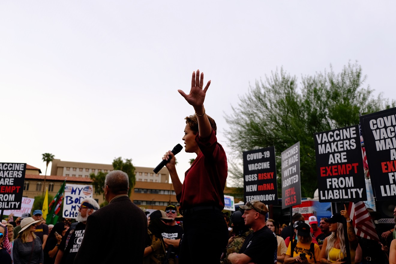Kari Lake speaks at an anti-vaccine rally in Phoenix.