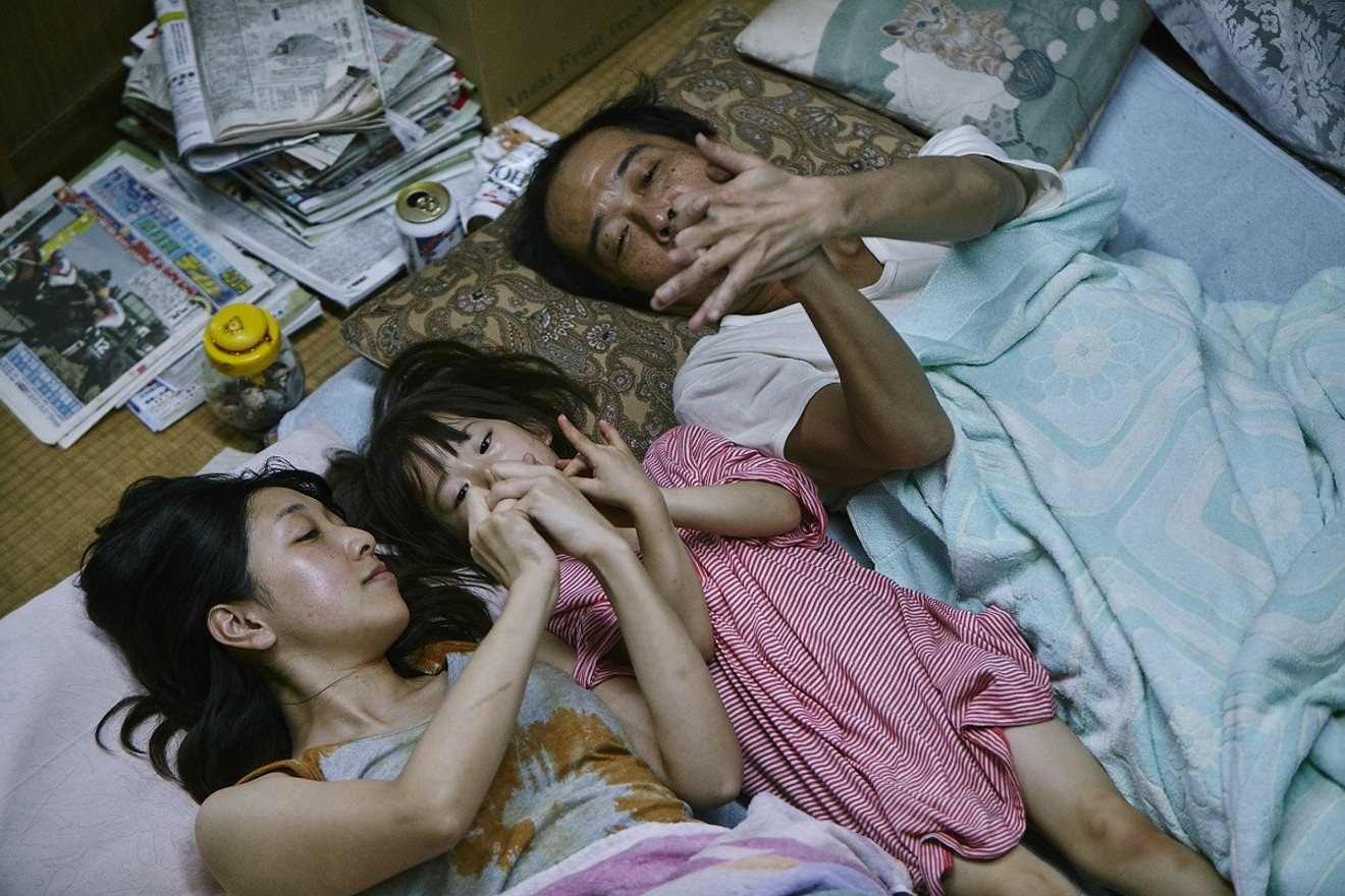 In Hirokazu Kore-eda's Shoplifters, the heads of a household trying to survive include father Osamu (played by Lily Franky, right) and his wife Nobuyo (Sakura Ando, left), who find a young girl named Yuri (Miyu Sasaki) and decide to keep her.