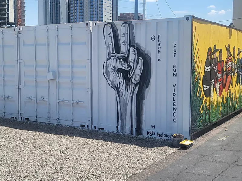 Image: As part of his Gun Violence Awareness National Tour, artist Kyle Holbrook painted antigun violence murals on two walls in Roosevelt Row.