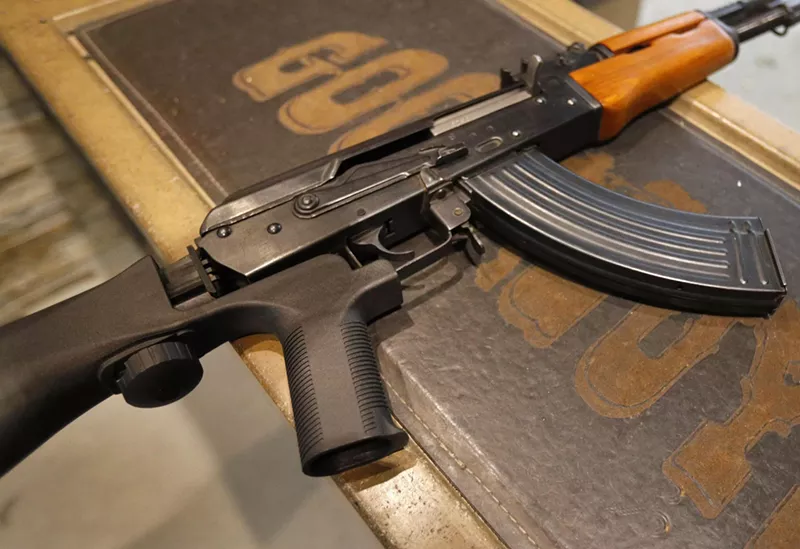 Image: An AK-47 with a bump stock installed