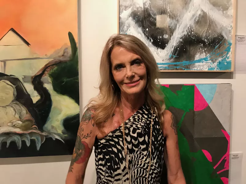 Image: Laura Dragon during the opening reception last year's "Heart of the Dragon" exhibit at {9} The Gallery.