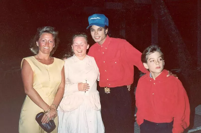 Image: Michael Jackson with Jimmy Safechuck (right) and fans. Safechuck alleges that Jackson abused him.