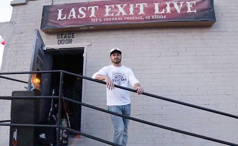 Last Exit Live owner Brannon Kleinlein outside the bar's stage door.