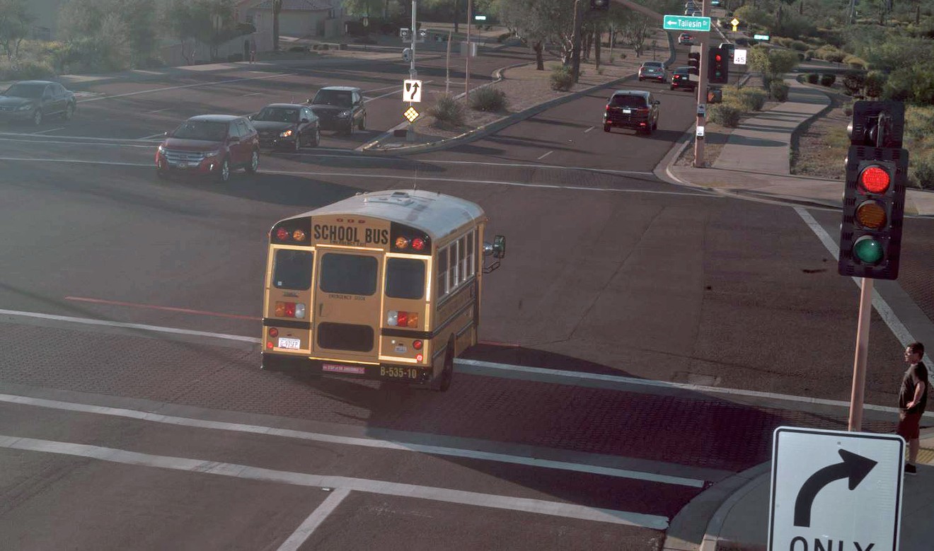 A school bus registered to Scottsdale Unified School District 48 runs a red light on March 29. No one responded to the notice of violation, records show.