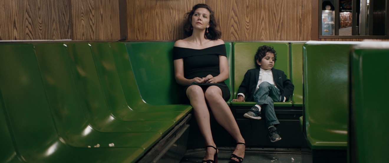 In Sara Colangelo’s The Kindergarten Teacher, Maggie Gyllenhaal (left) plays Lisa, the title character, who takes an insistent interest in the life and (apparent) art of 5-year-old student Jimmy (Parker Sevak).