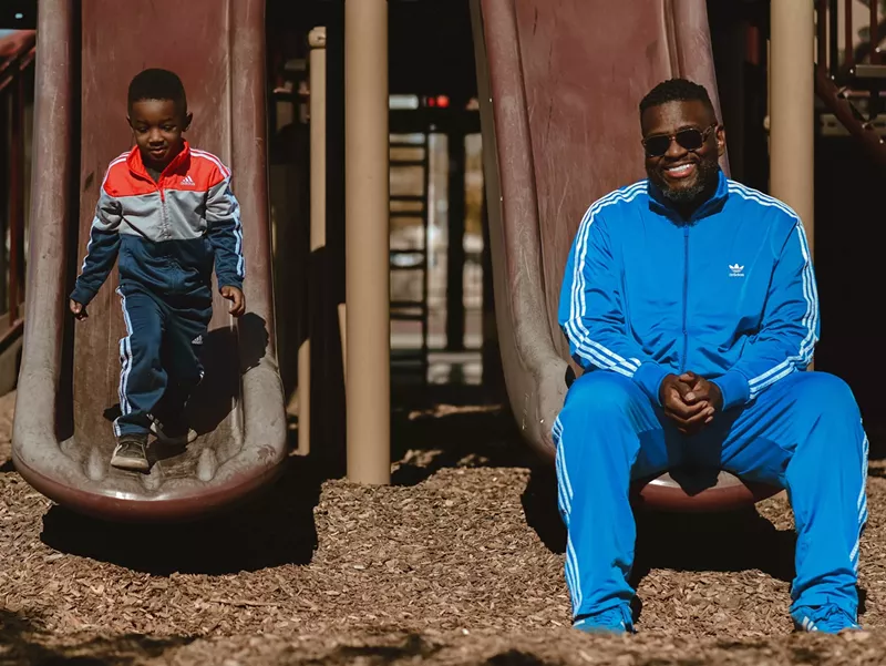 Image: Phoenix rapper Mega Ran, right, with his son.