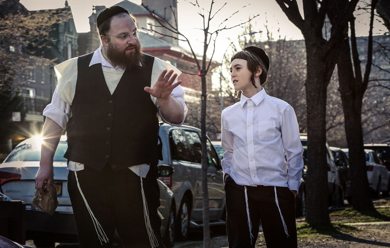 Menashe Lustig (left), appearing in a scene with Ruben Niborski, stars as the title character in Menashe.