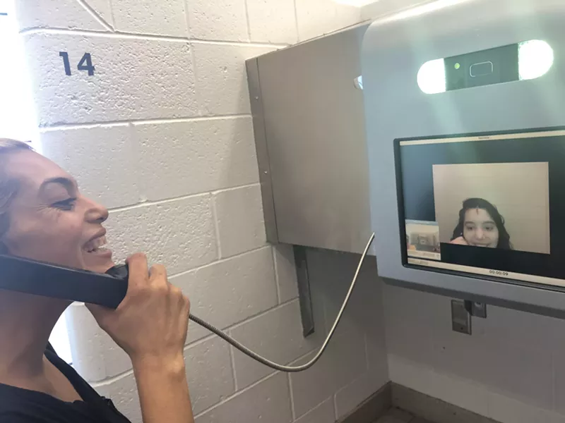 Image: Vangelina and her daughter Valentina Gloria talk on Monday, July 29. She asks her to smile before their 15-minute video visitation ends.