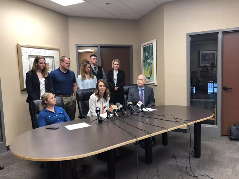 Image: Several of the claimants at a morning press conference announcing the notice of claim.