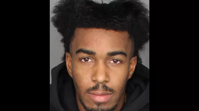 a mugshot of a young man