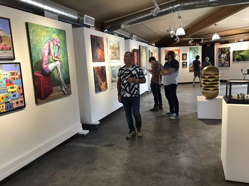 Image: Checking out a group show at Grand ArtHaus, one of many venues temporarily closed due to COVID-19 precautions.