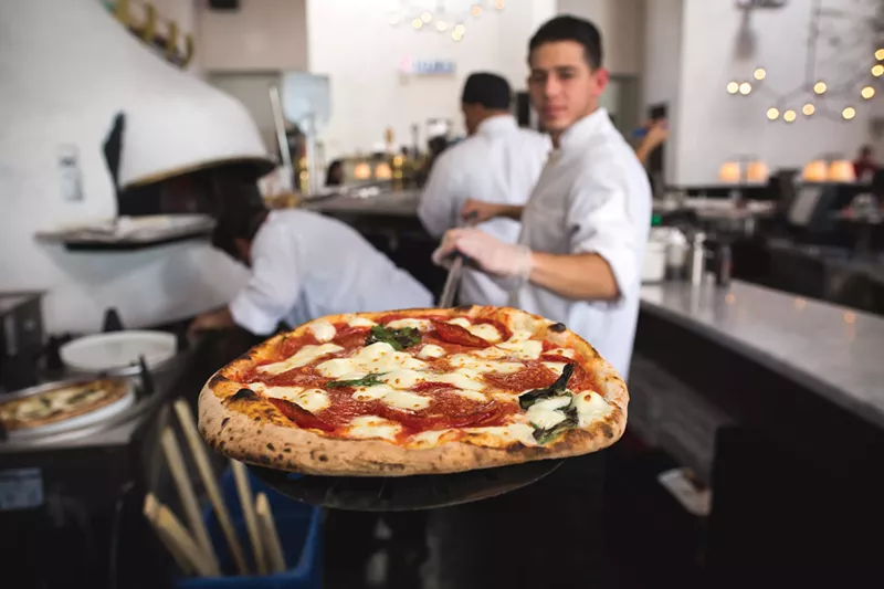 Image: A freshly blazed pie at MidiCi in Desert Ridge Marketplace.