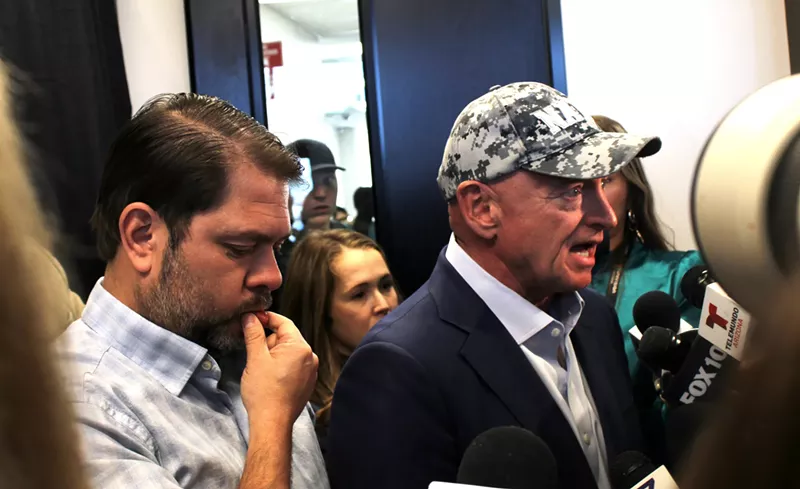 Image: ruben gallego and mark kelly speak to a gaggle of reporters