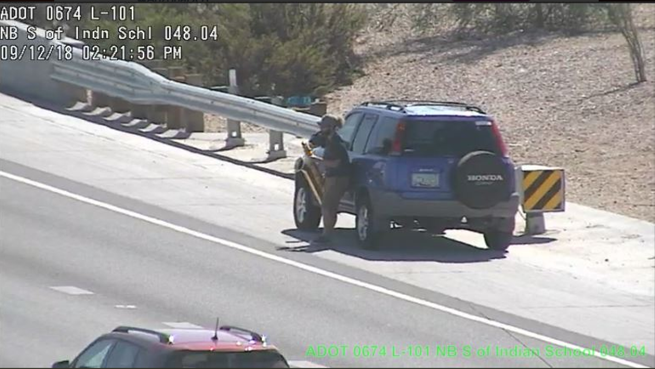 Mystery man whips out a saxophone on the Loop 101 freeway