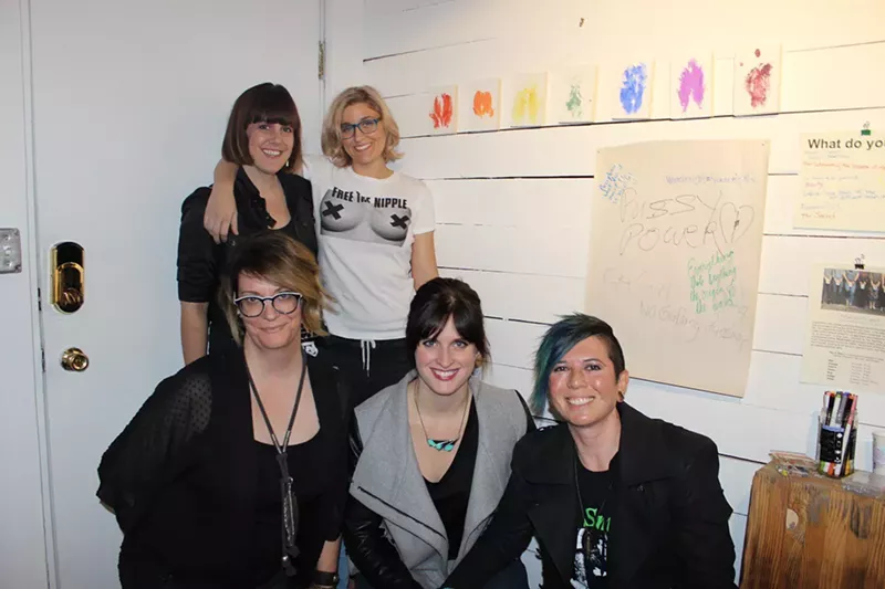 Image: Getting into group hug mode at the "Nasty Women: Phoenix Unite" exhibition.