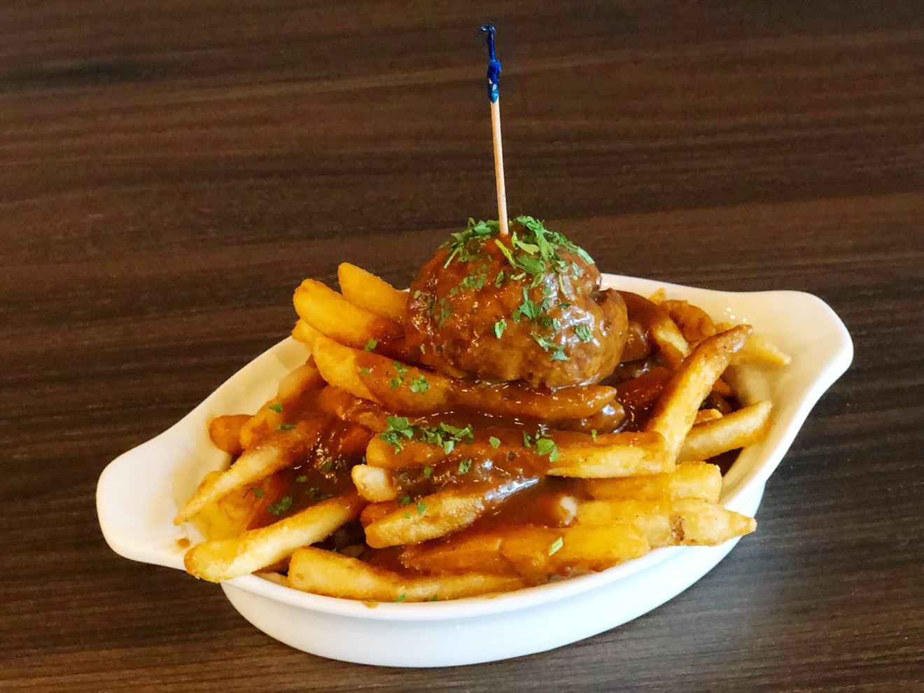 The poutine at Meatballz Inc. comes with a meatball of choice on top of sturdy fries covered in rich mushroom gravy and cheese curds.