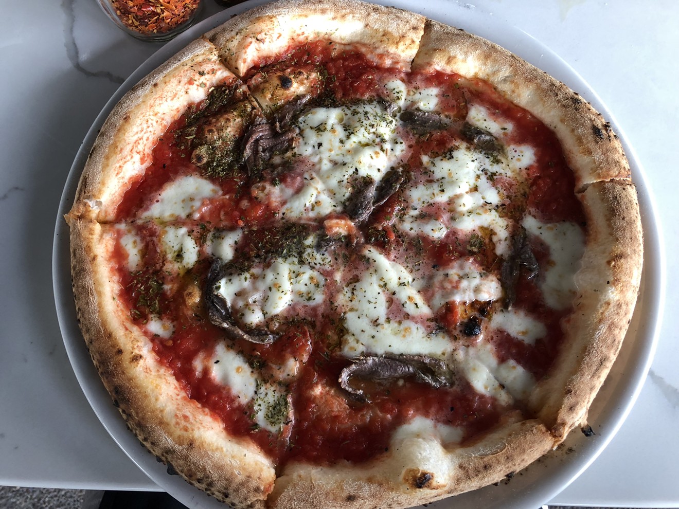 The Neapolitan pizza at Pomo will be back as its downtown Phoenix location re-opens Thursday, October 25.