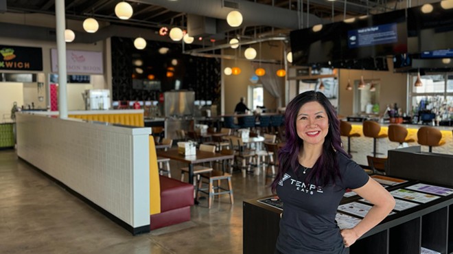 Teresa Nguyen stands in a food hall.