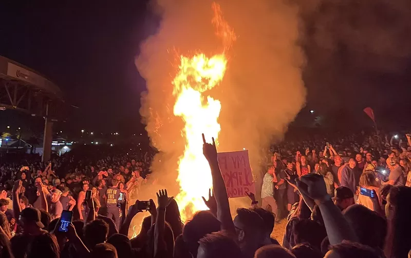 Image: A photo of the fire in the crowd during Slipknot's set on Tuesday at Ak-Chin Pavilion.