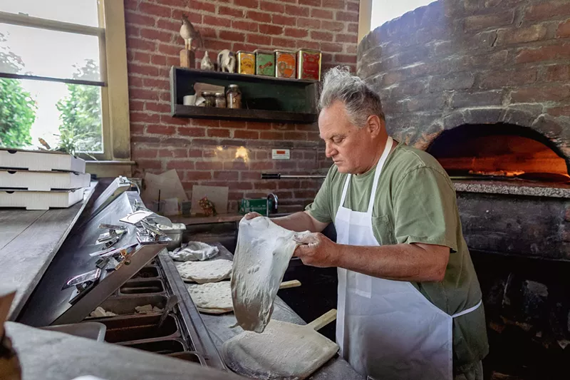 Image: Chris Bianco stretches dough at his pizzeria in downtown Phoenix.