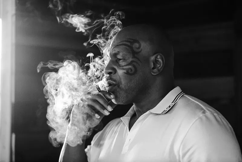 Image: mike tyson smoking a blunt