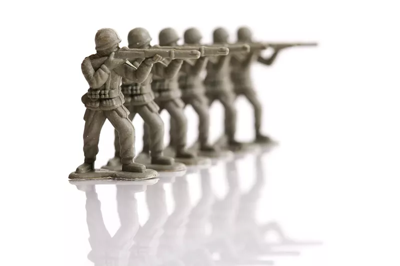 Image: toy soldiers lined up in a firing squad