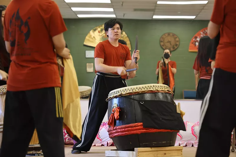 Image: Golden Phoenix Lion Dance Arts and Athletic Association head coach J Lantry leads the Lion Dance team in music practice