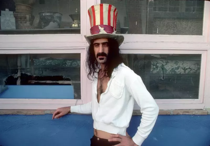 Image: Rock and roll guitar player Frank Zappa poses for a portrait wearing an Uncle Sam stars & stripes top hat in March 1979 in Los Angeles, California.