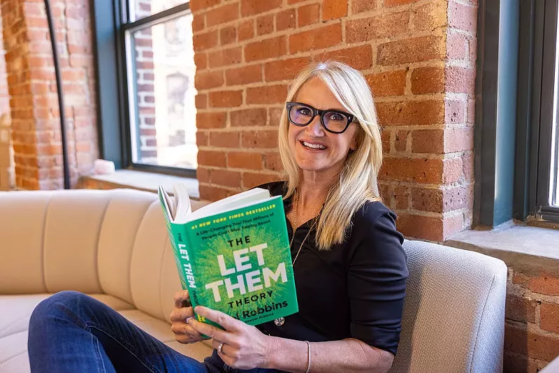 Image: Mel Robbins reads her smash hit book "The Let Them Theory," a #1 New York Times and #1 Sunday Times bestseller, in the studios of her production company, 143 Studios, on April 21, 2025, in Boston, Massachusetts.