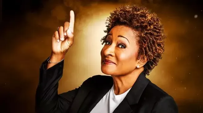 A Black woman pointing up.