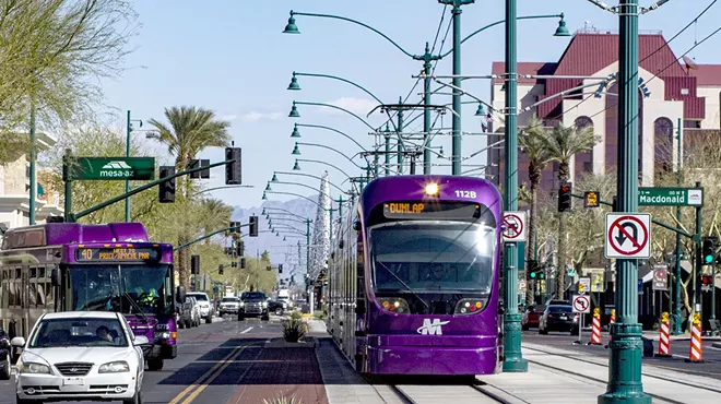 Valley Metro Rail stops at a station.