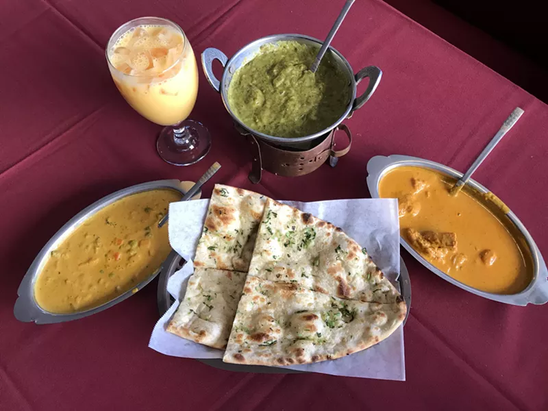 Image: Enjoy an authentic Punjabi meal. Chicken tikka masala, vegetable korma and saag paneer complement each other well.