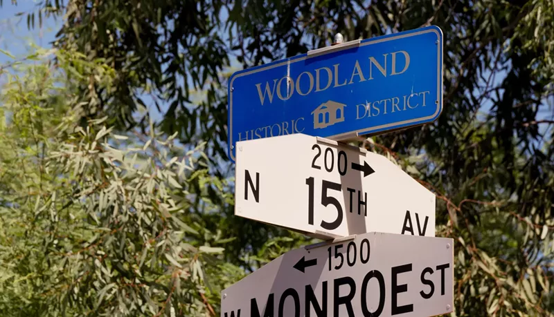 Image: street intersection signs in the woodland historic district