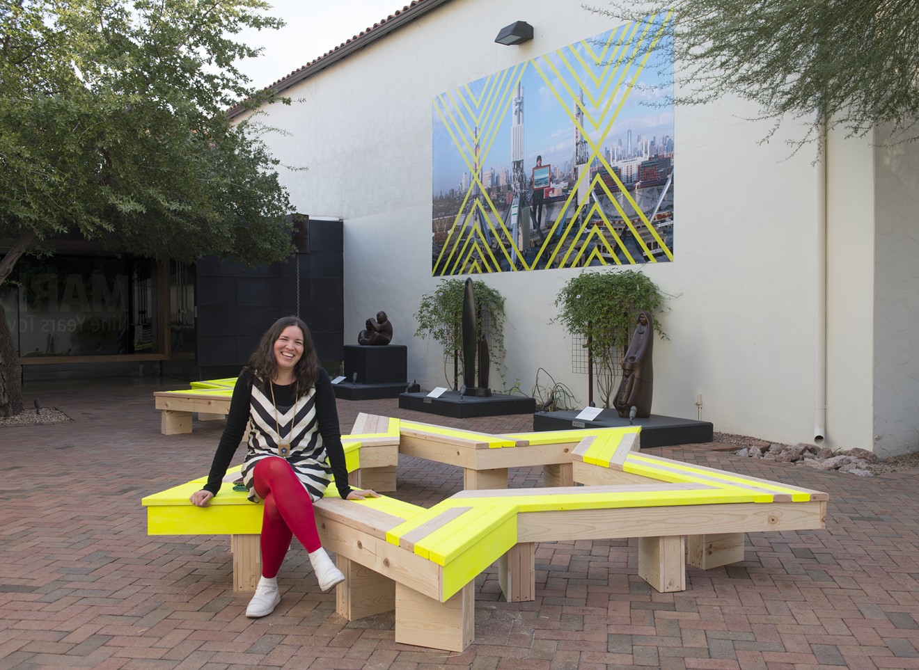 Maria Hupfield with her work exhibited in an outdoor courtyard at the Heard Museum.