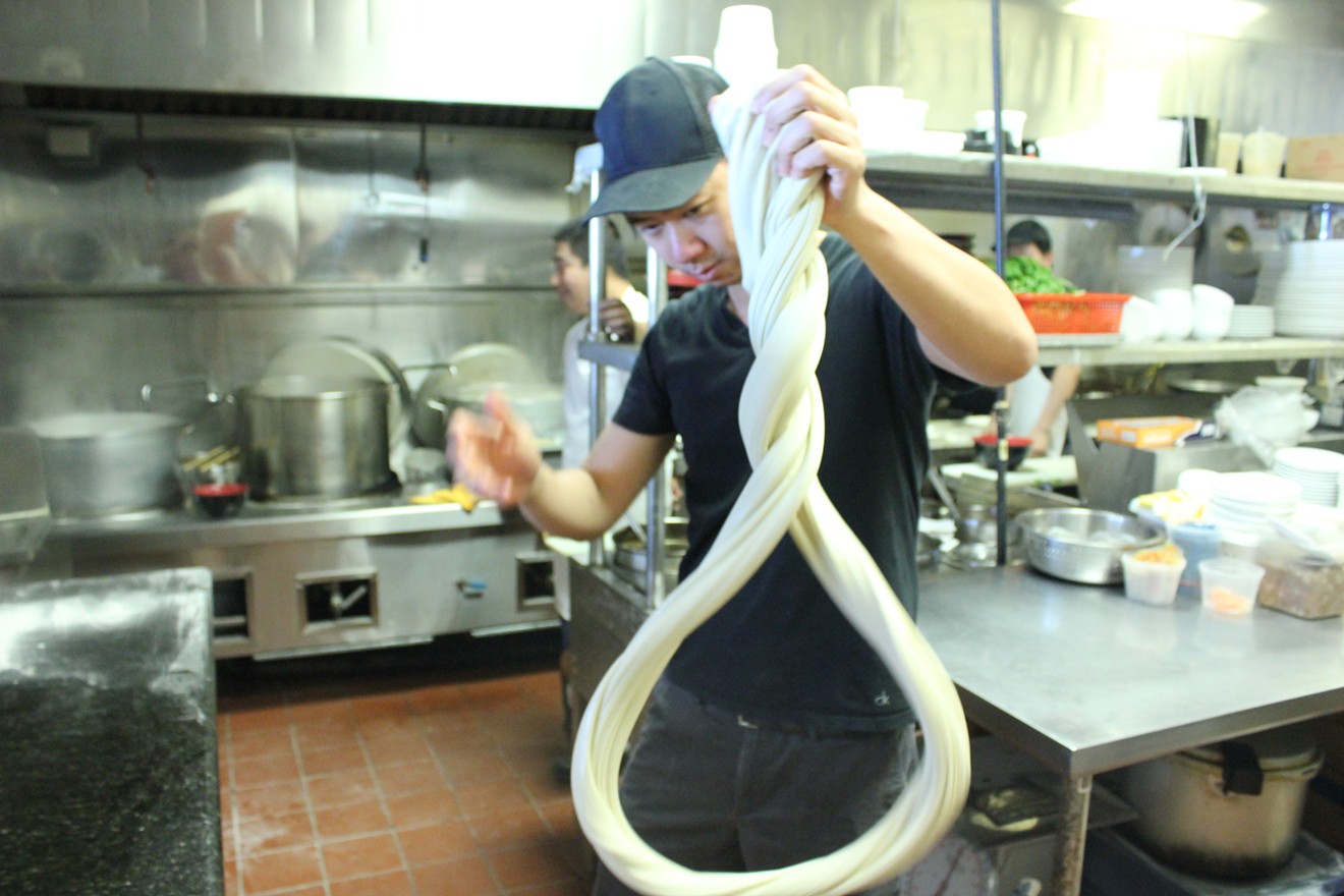 Stretching hand-pulled noodles at China Magic Noodle House in Chandler
