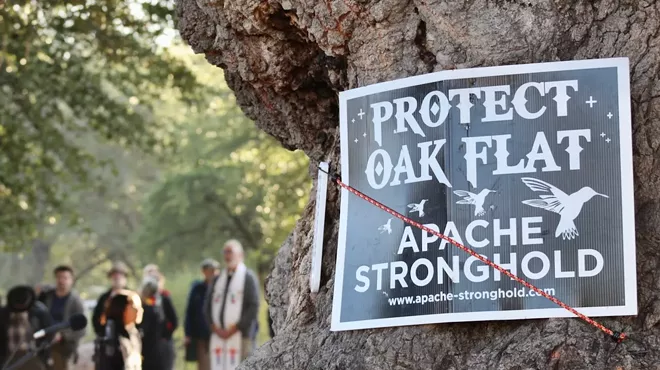 a sign that says "protect oak flat"