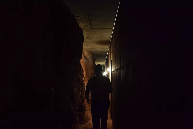 Image: One of the narrow hallways of the fallout shelter, which was cut underground and into the side of a mountain.