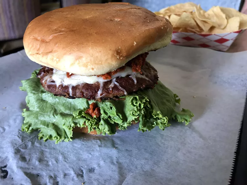 Image: A cheeseburger with red chile Chimayo.