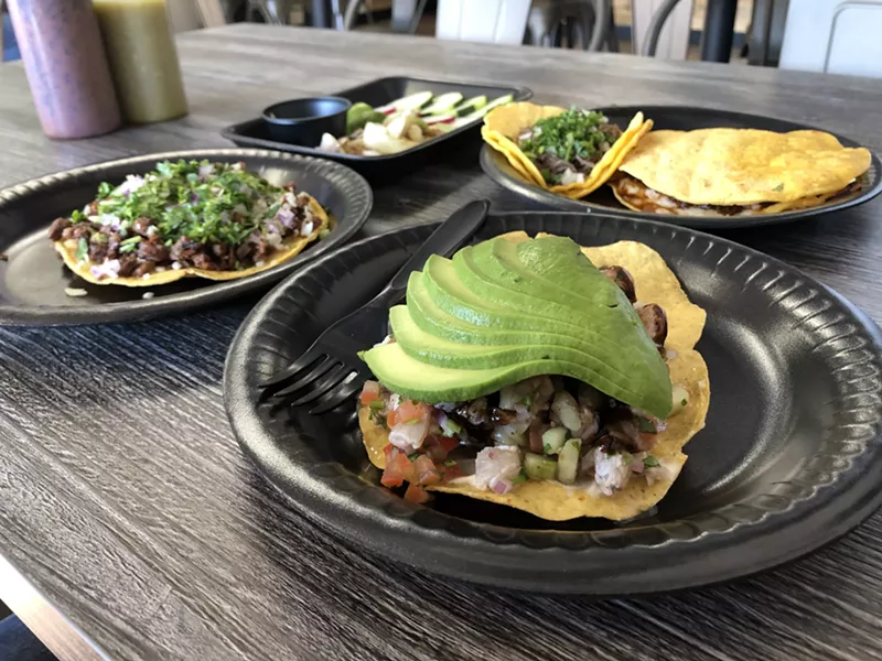 Image: Carne asada vampiro, cabeza taco, birria mula, and ceviche tostada (front).