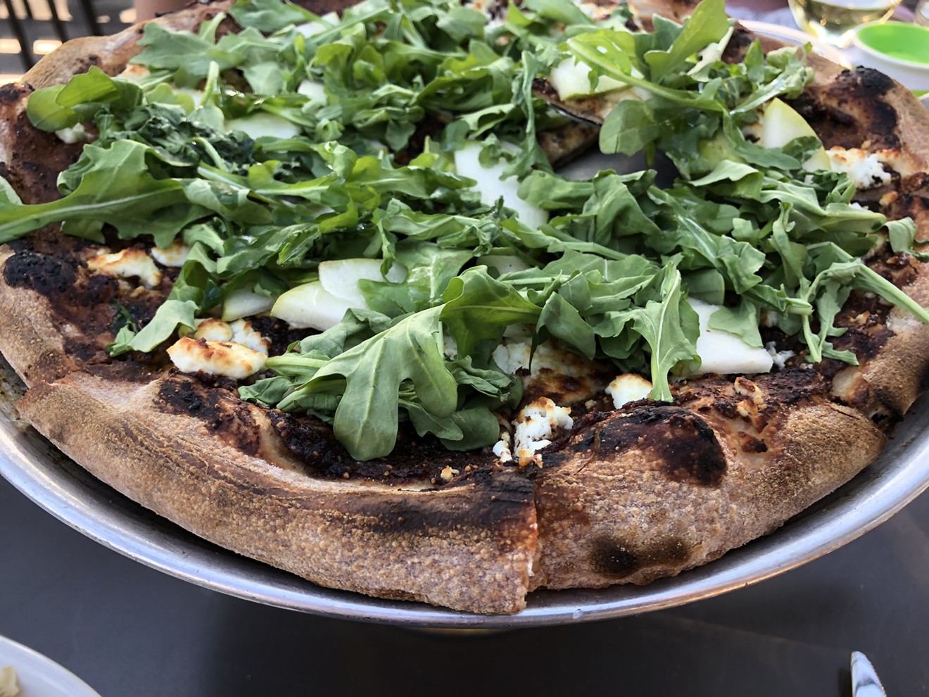 Pizza with truffle, figs, and arugula from Pitch.
