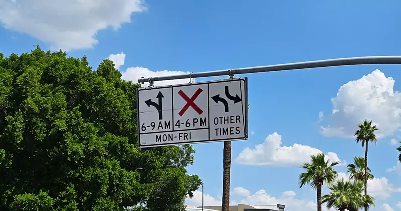 Image: a sign that shows left turns ok during some hours, prohibited during others
