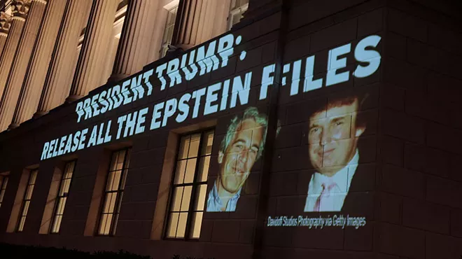 An image of Donald Trump and Jeffrey Epstein, along with the words “President Trump: Release All the Epstein Files,” is projected onto the U.S. Chamber of Commerce building on July 18.