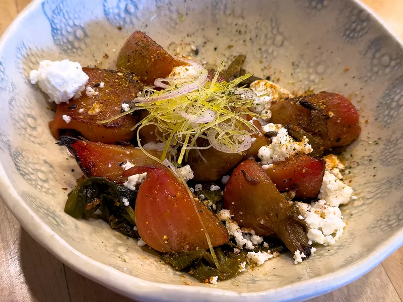 Image: At Pa'La, roasted Chioggia beets sit on a pile of their own fermented tops, lending them a tart kimchi-like bite.