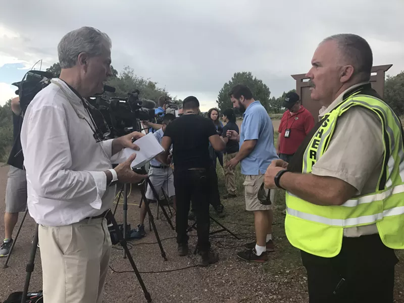 Image: Sergeant David Hornung holds a press conference describing the transition to a Type 3 Incident team.