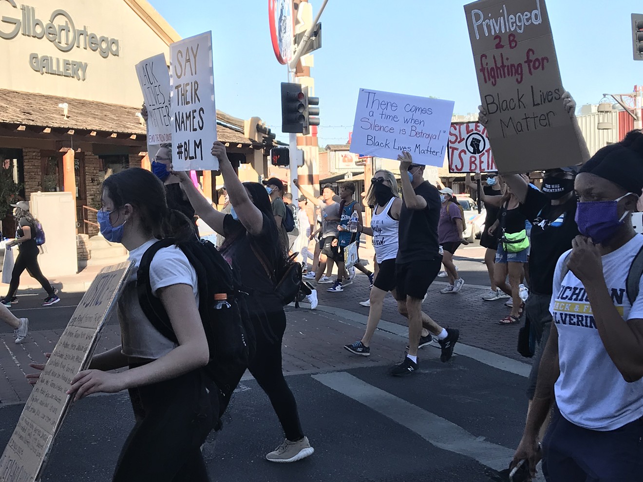 Protesters marching peacefully along Scottsdale Road in Old Town.