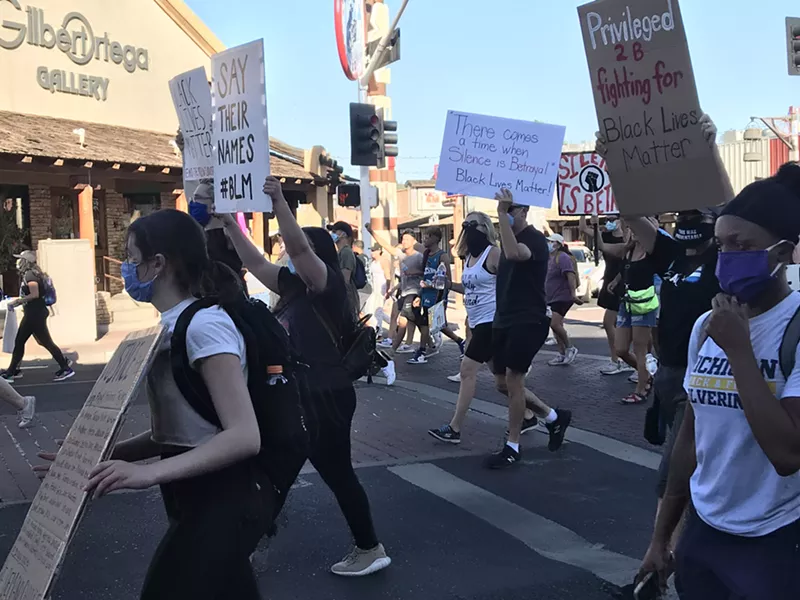 Image: Protesters marching peacefully along Scottsdale Road in Old Town.