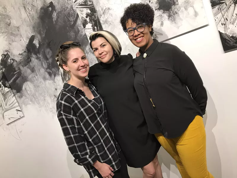 Image: Jessica Palomo (center) flanked by friends and fellow artists while her work was exhibited at Bentley Gallery in Phoenix.