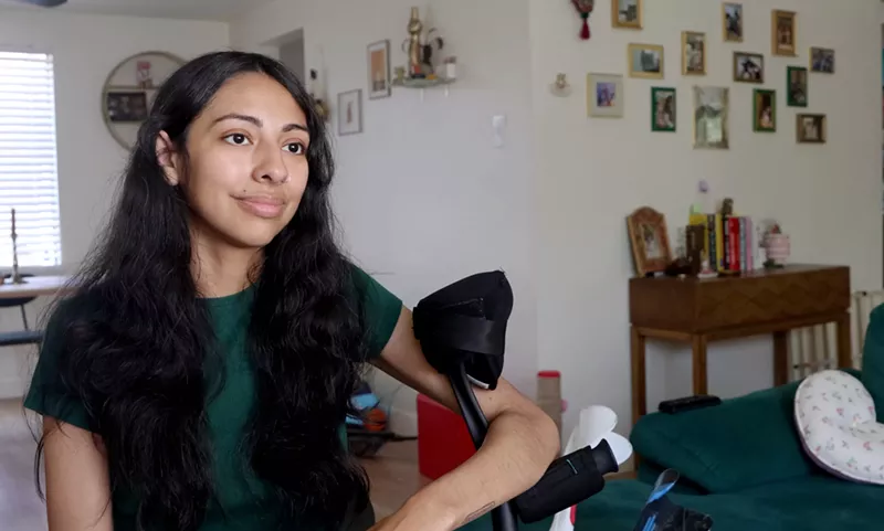 Image: A young woman in her home