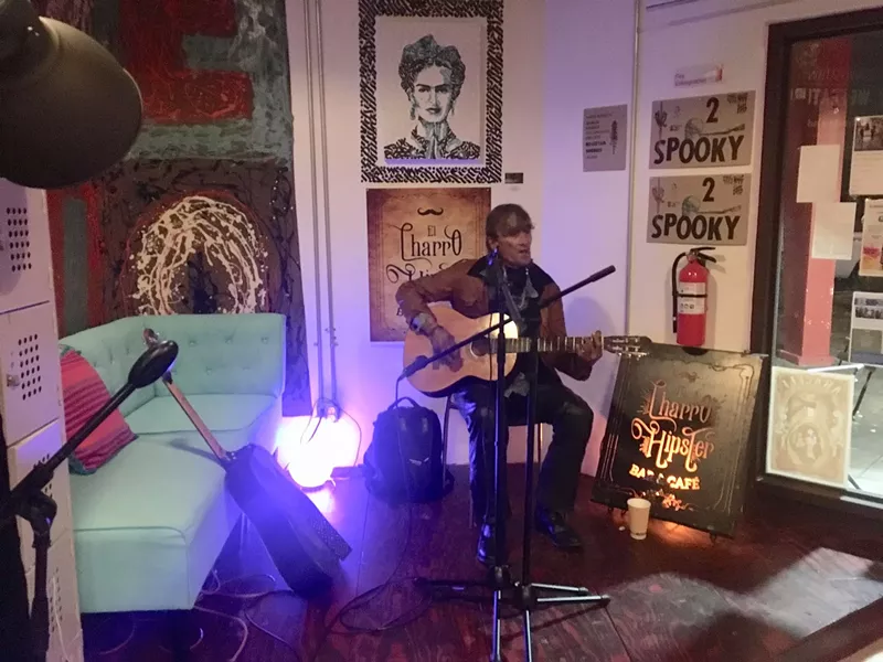 Image: Here's Tom performing recently inside El Charro Hipster Bar & Cafe.